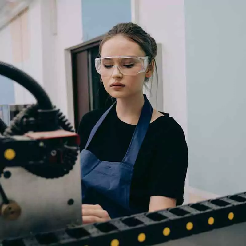 Woman wearing goggles while working